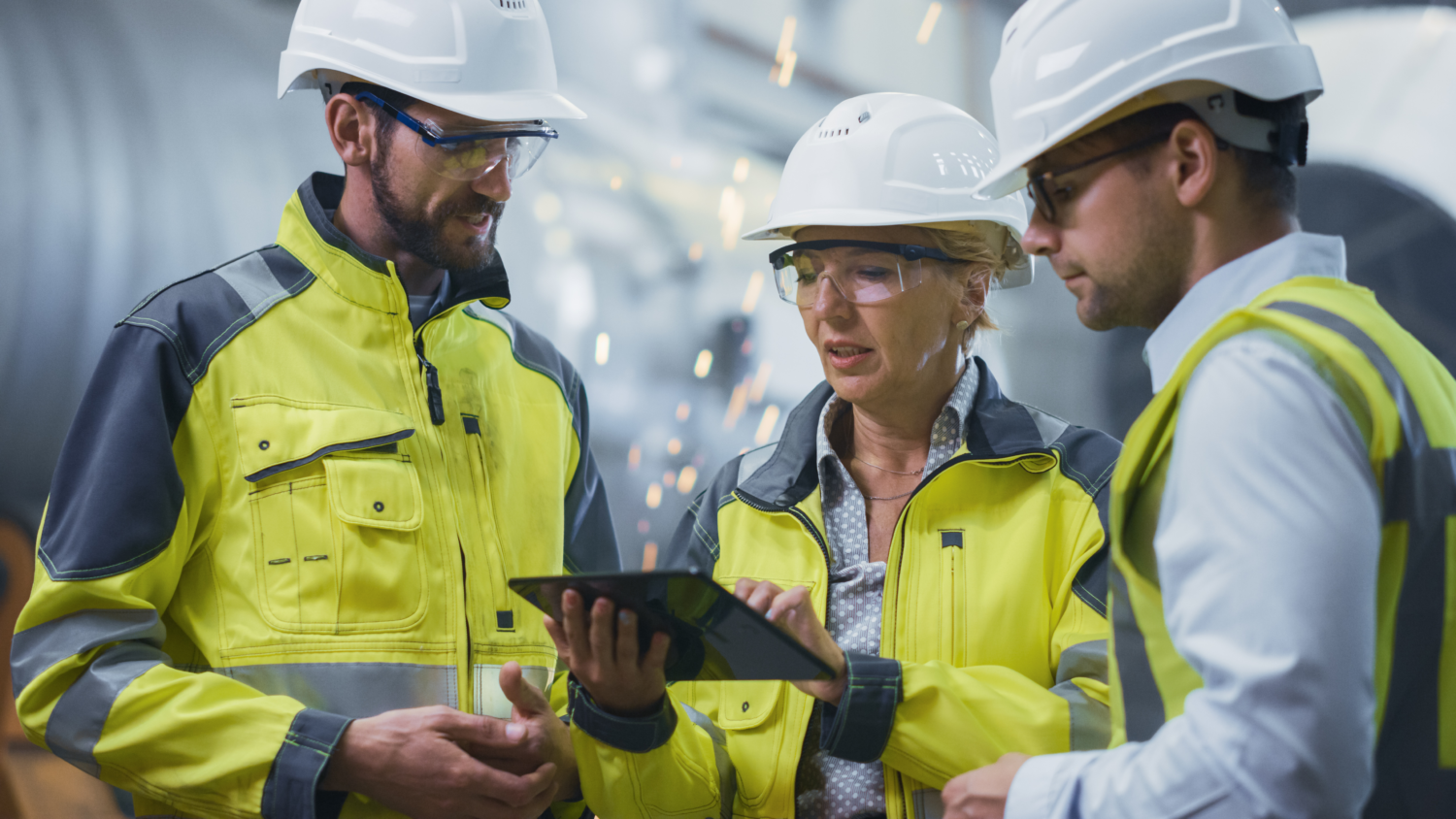 Colleague discussing operations plan on manufacturing floor